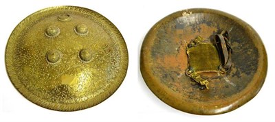 Lot 361 - A 19th Century Indian Brass Dhal, of convex circular form with dished border, all over chased...