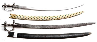 Lot 363 - A 19th Century Indian Talwar, the 74cm steel blade double edged towards the tip, the steel hilt...