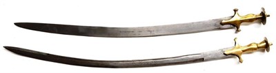 Lot 366 - A 19th Century Indian Talwar, with 74cm single edge curved steel blade, the brass hilt with...