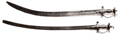 Lot 369 - An 18th Century Indian Talwar, with 78cm single edge curved steel blade, the steel stirrup hilt...