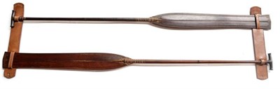 Lot 379 - A Pair of 20th Century Malaysian Ceremonial Oars, of dark red hardwood, each with spatula type...