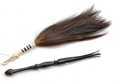 Lot 400 - An African Fly Whisk, with intertwined carved bone handle, possibly Makonde; an Ebonised Wood...