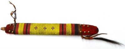 Lot 402 - A North American Indian Beadwork Pipe Stem, of flattened rectangular form, applied with bands...