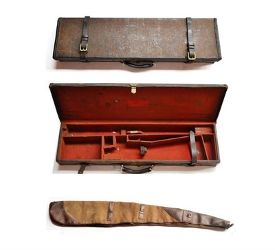 Lot 414 - A Leather Trimmed Canvas Shotgun Case, with brass lock and strap buckles, the crimson baize...