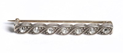 Lot 237 - A Diamond Bar Brooch, seven connected lozenge shaped form the bar, each claw set with an old...