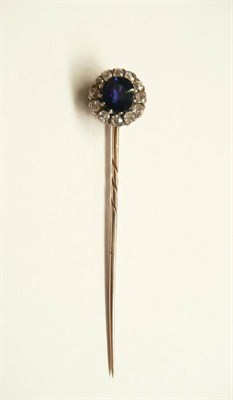 Lot 241 - A Sapphire and Diamond Stick Pin, the old brilliant cut sapphire within a border of old cut...