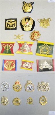 Lot 90 - A Collection of Twenty Post Second World War Malaysian Army and Indonesian Forces Badges, in brass