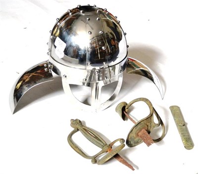 Lot 166 - A Copy of a Viking Helmet, in polished steel with pierced visor, hinged ear protectors and neck...