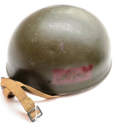 Lot 168 - A Second World War British Paratrooper's helmet by BMB, the dark green painted skull with red...