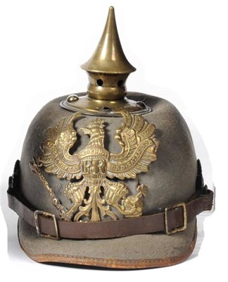 Lot 172 - A First World War Field Grey Felt Ersatz Pickelhaube, with brass helmet plate and spike,...