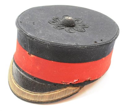 Lot 174 - A Victorian Officer's Peaked Forage Cap, in black wool with red band, the top with woven black...