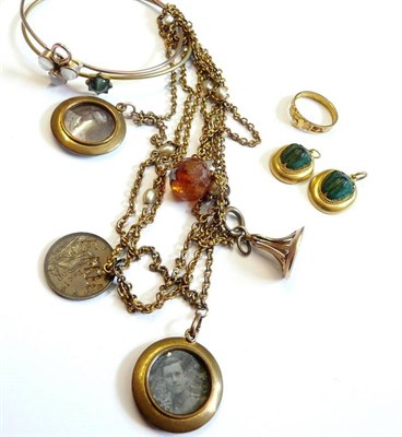 Lot 263 - Jewellery, including two scarab pendants, a moonstone bangle, a cat's-eye bangle, a claddagh...