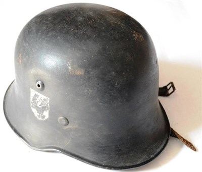 Lot 222 - A German Third Reich TENO Model SS/SD Medium Duty Helmet, painted black with double decals, leather