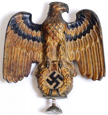 Lot 225 - A German Third Reich Cold Painted Metal Army Eagle Car Mascot, well cast and detailed with red...