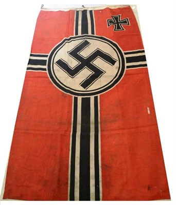 Lot 228 - A German Third Reich Kriegsmarine Flag, in red cotton printed with a black swastika and cross,...