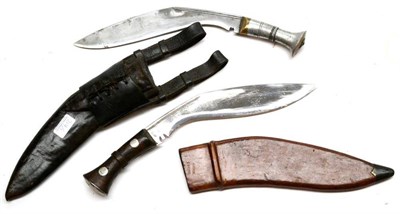 Lot 317 - A First World War Kukri, with aluminium hilt, leather scabbard and frog; a Second World War...