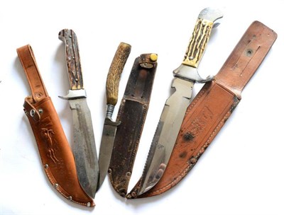 Lot 323 - A German Small Hunting Knife, the curved blade etched SOLINGEN, with antler handle and leather...