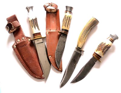 Lot 327 - Four Hunting Knives, each with antler handle, two with leather sheaths (4)