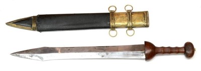 Lot 347 - A Copy of a Roman Gladius, with 52cm double edge spearpoint steel blade, carved wood hilt and brass