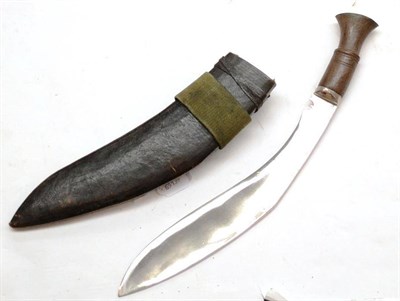 Lot 356 - A Nepalese Kukri, with dot and loop engraved curved steel blade, wood hilt with white metal...