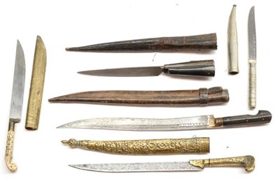 Lot 377 - An Indian Knife, with straight steel blade, foliate embossed earred hilt and scabbard; four Various