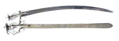 Lot 378 - A 19th Century Indian Talwar, the 74cm single edge broad Khanda type blade with a central...