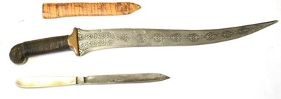 Lot 386 - An 18th Century Persian Jambiya, the 37cm double edge recurving steel blade with arabesque engraved