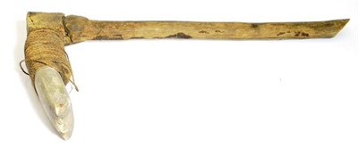 Lot 391 - A 19th Century Polynesian Adze, the grey hardstone blade secured to the wood haft with twisted...