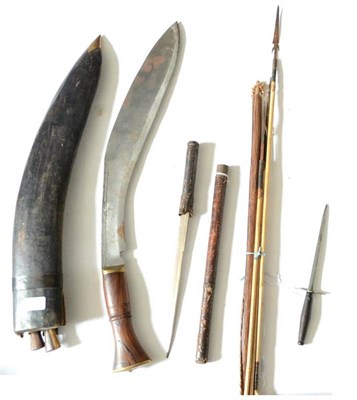 Lot 394 - A Large Indian Kukri, with brass mounted hardwood grip and leather scabbard set with sharpening and