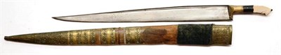 Lot 396 - A 19th Century Khyber Knife, the 59cm T section steel blade with a narrow fuller to the back...