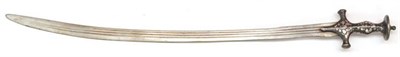 Lot 420 - An 18th Century Indian Talwar, the 76cm single edge curved steel blade with three narrow...