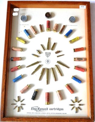 Lot 456 - A Concentric Display of Eley Kynoch Cartridges, inert bullets and wasp pellets, in a glazed oak...