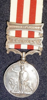 Lot 289 - An Indian Mutiny Medal 1858, with two clasps LUCKNOW and DEFENCE OF LUCKNOW. awarded to...