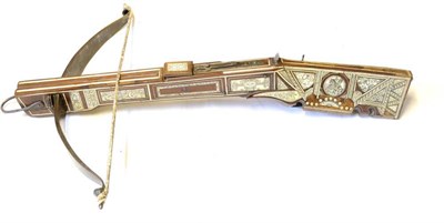 Lot 522 - An 18th Century Style German Bone Inlaid Walnut Crossbow, the 66.5cm steel bowstave with hollow...