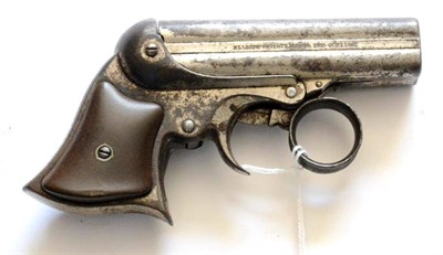 Lot 589 - An E Remington Ring Trigger Four Barrel Deringer, the 8.5cm steel barrels numbered 24142, the...