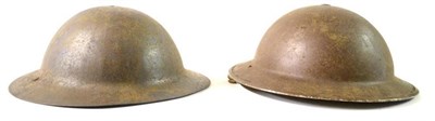 Lot 140 - A First World War Brodie Helmet, with remnants of felt lining to the skull, split rivets...