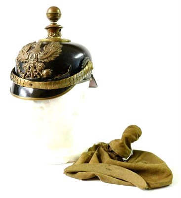 Lot 146 - A Prussian Artillery Officer's Leather Pickelhaube, with brass ball top, with two ventilation holes