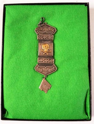 Lot 171 - A German Third Reich Latrian Silver Mounted Leather Fob Strap, applied with a gold Death Head, hung