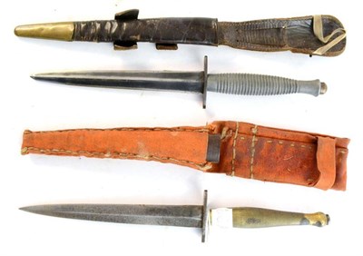 Lot 200 - A British Second Pattern Commando Knife, with 16.5cm hand forged double edge steel blade, plain...