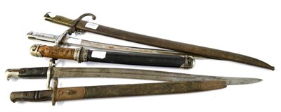 Lot 245 - Four Bayonets:- two Chassepot bayonets, one with scabbard, the other with chromed finish; a British