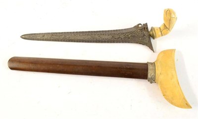 Lot 253 - A 19th Century Malayan Kris, with 36cm double edge straight pamor steel blade, the ivory Garuda...