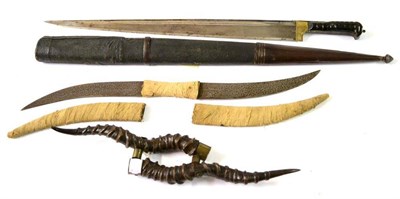 Lot 264 - A 19th Century Afghan Khyber Knife, the 60cm T section steel blade with brass plate at the...