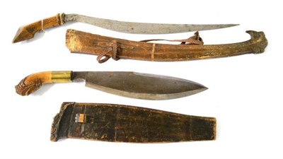 Lot 274 - A Philippino Talibon, the 49cm steel blade straight on the back  and curved on the edge, with...