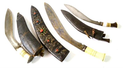 Lot 277 - A Large Indian Kukri, the 50cm steel blade inlaid with brass tendrils and swags, with bone grip and