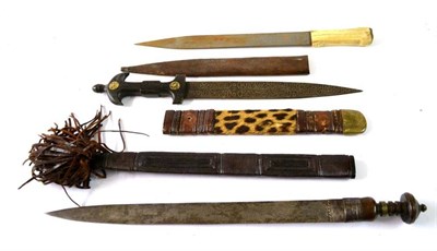 Lot 280 - A Mandingu Short Sword, the 48cm plain double edge steel blade with reinforced panel to the...