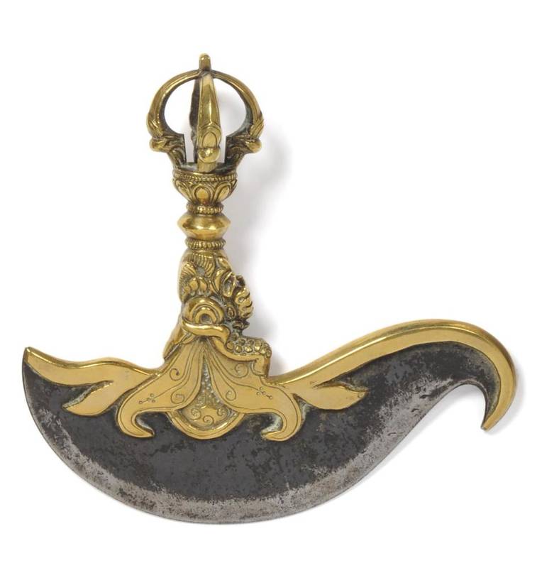Lot 283 - A 19th Century Tibetan Ritual Knife, the 16cm blued steel crescent shape blade with scroll...