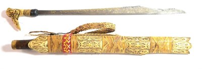 Lot 293 - A 19th Century Dyak Head Hunter's Sword (Mandau), the 53cm clip-point steel blade pierced with...