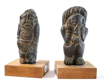 Lot 301 - Two Pre-Columbian Style Black Earthenware Figures, one standing with his hands raised to his...