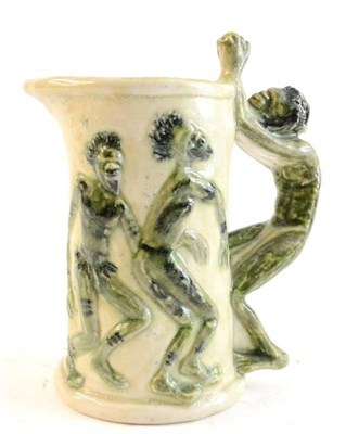 Lot 302 - An Unusual Australian Studio Pottery Jug, the cream body and handle modelled with dancing...