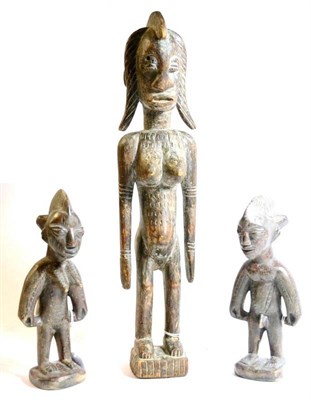 Lot 305 - An Igbo, Nigeria Wood Ancestor Figure as a Woman, standing naked on a square plinth, 54cm; a...